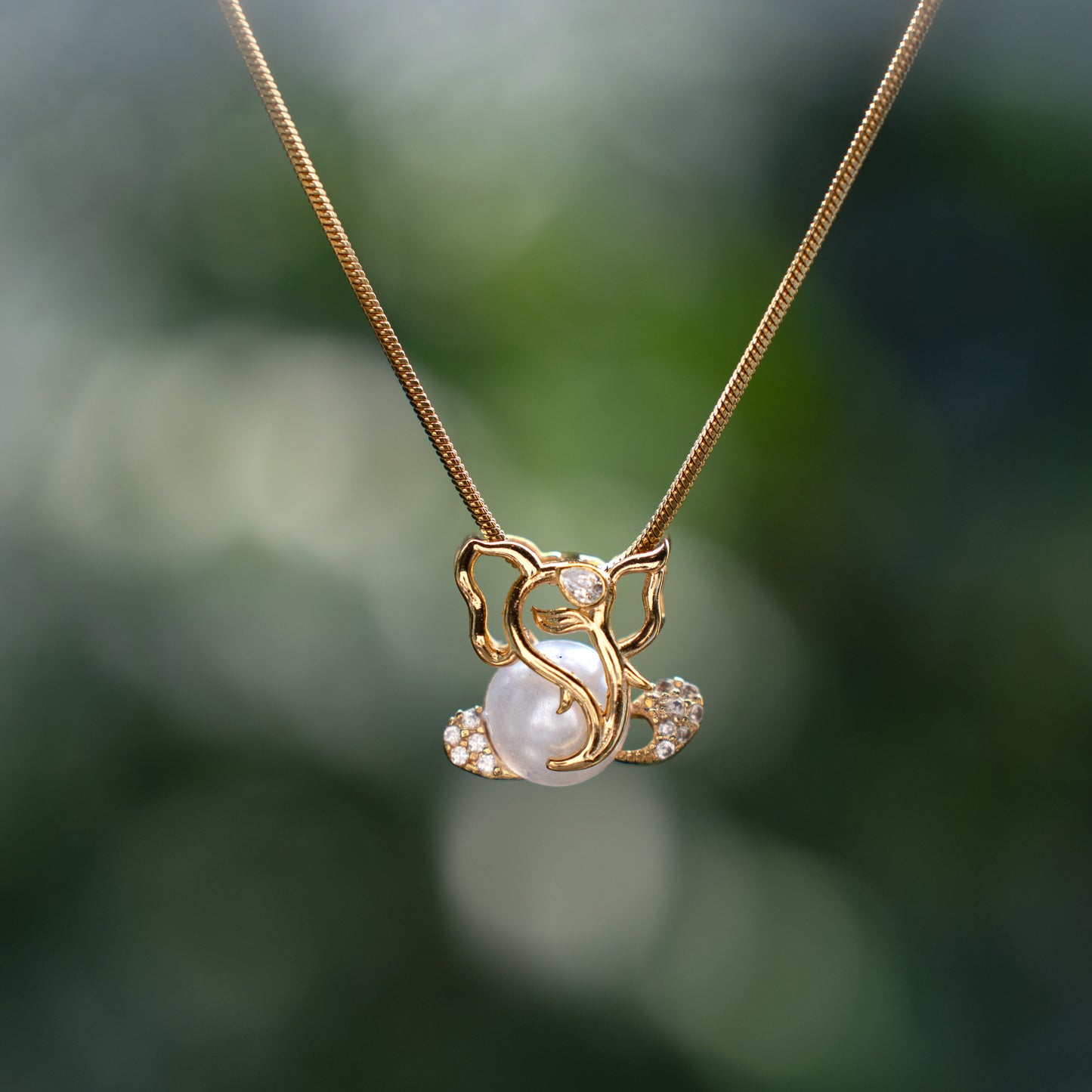 Zivia Pearl Ganesha Gold Plated Pendant with Chain.